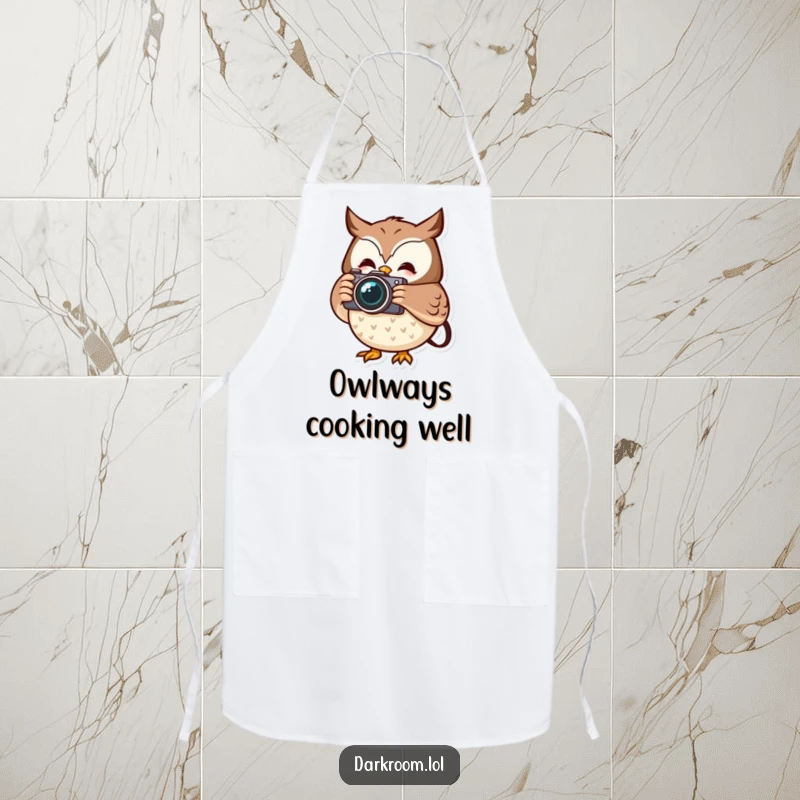 Funny cheerful owl photographer apron, holding a camera, capturing a fleeting moment, ready to assist in the kitchen with wisdom.