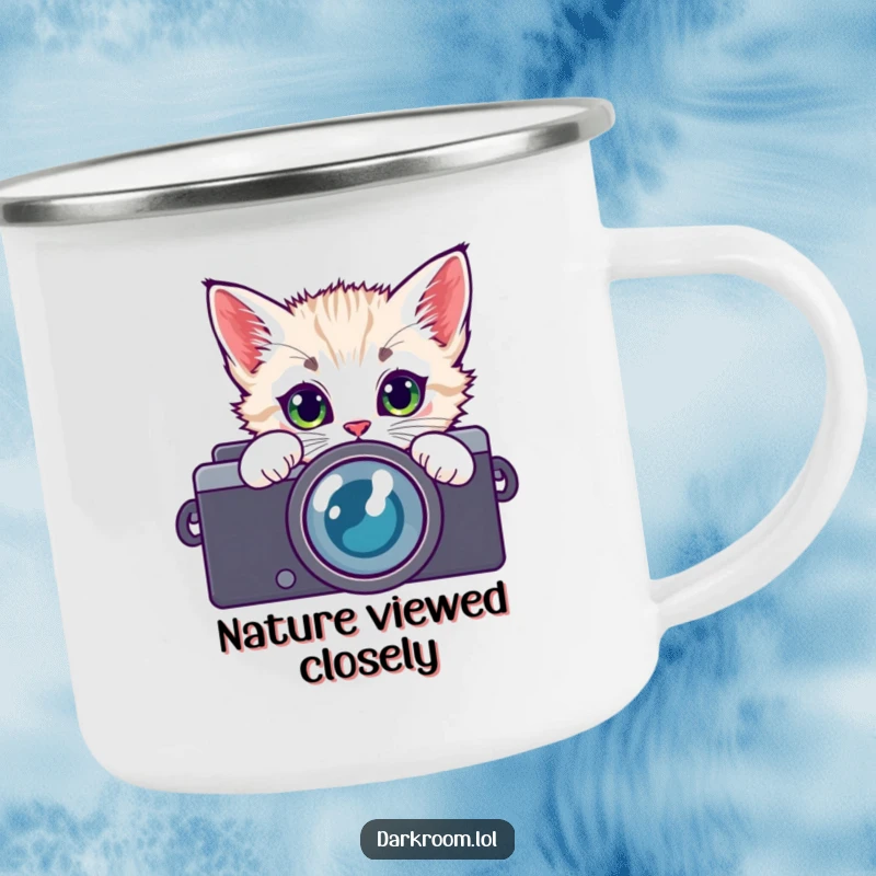 Funny kitten photographer camping mug, peeking through a camera lens with curious eyes, ready for any outdoor adventure and warm drink.