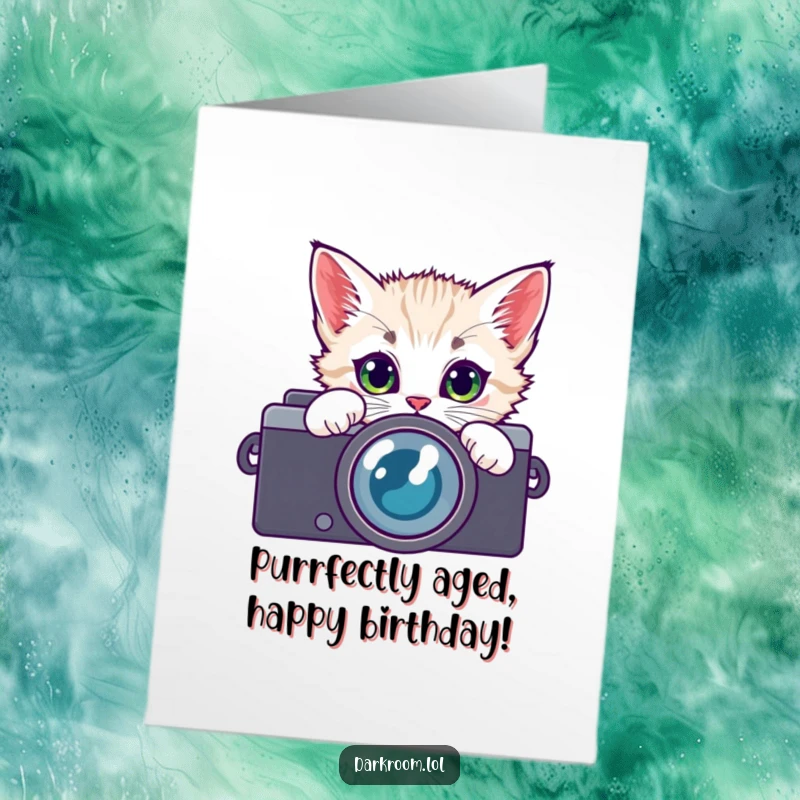 Funny Free Printable Birthday Card: Playful kitten with wide eyes peeking through camera lens, cute and humorous, digital download.