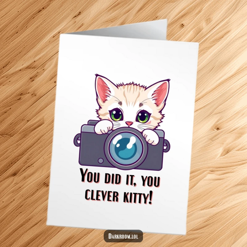 Funny Free Printable Congratulations Card: Playful kitten peering through a camera lens, celebrating your achievement, print at home.